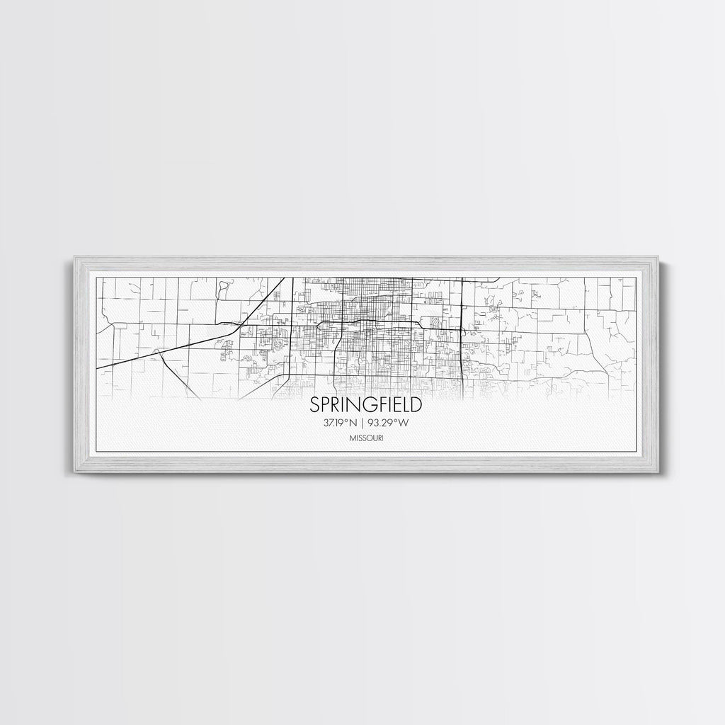 White framed wall art with map lines and the word “SPRINGFIELD” plus coordinates