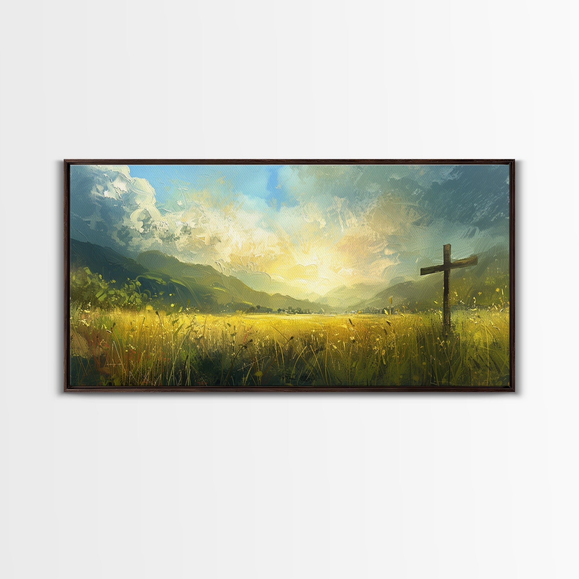 Framed canvas print of a cross standing in tall grass with glowing clouds