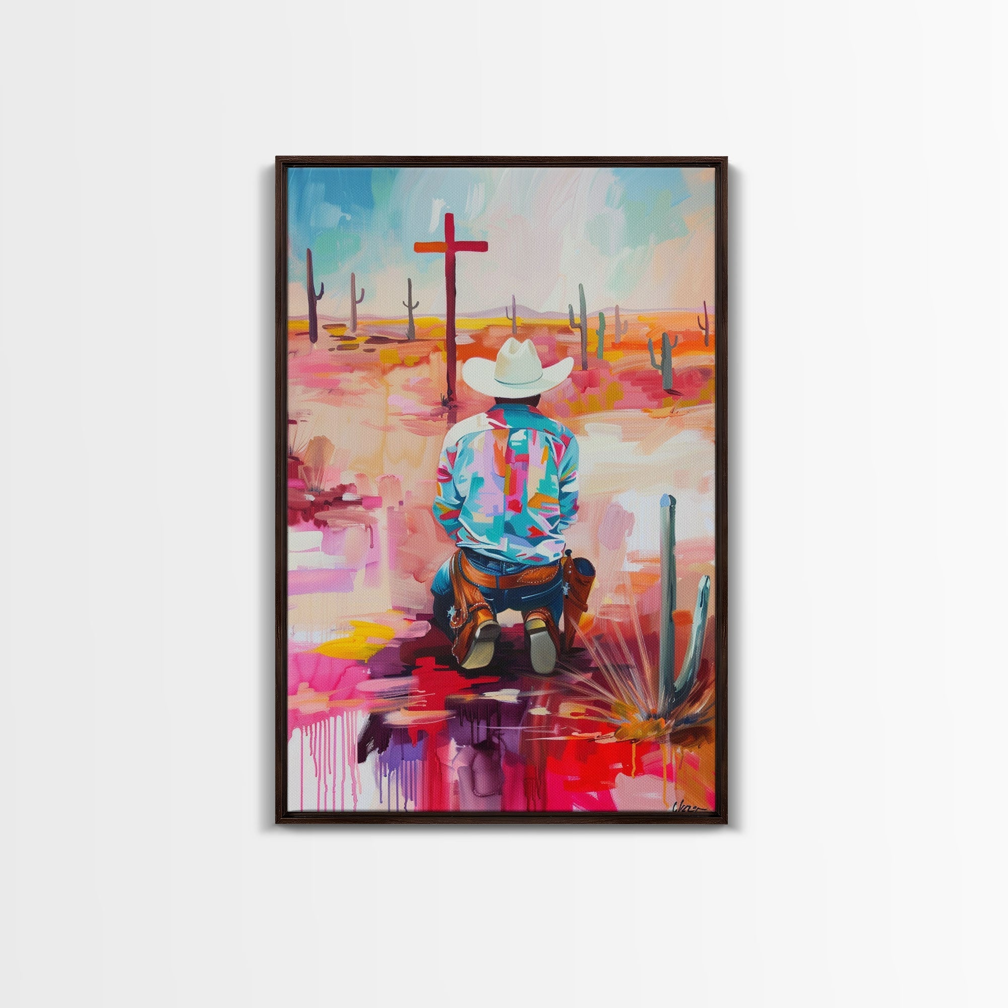Framed canvas print of an abstract kneeling cowboy in a colorful Southwestern desert scene, black frame