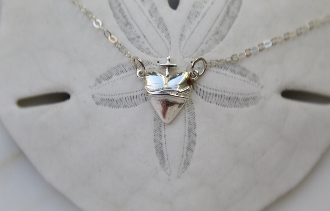 Sterling silver heart pendant with cross and chain, centered view