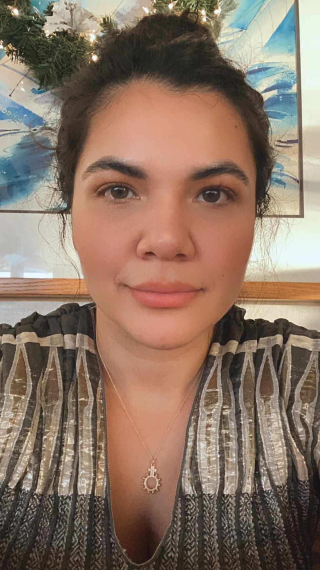 Gold rosary bead necklace with circular halo charm and small cross accents