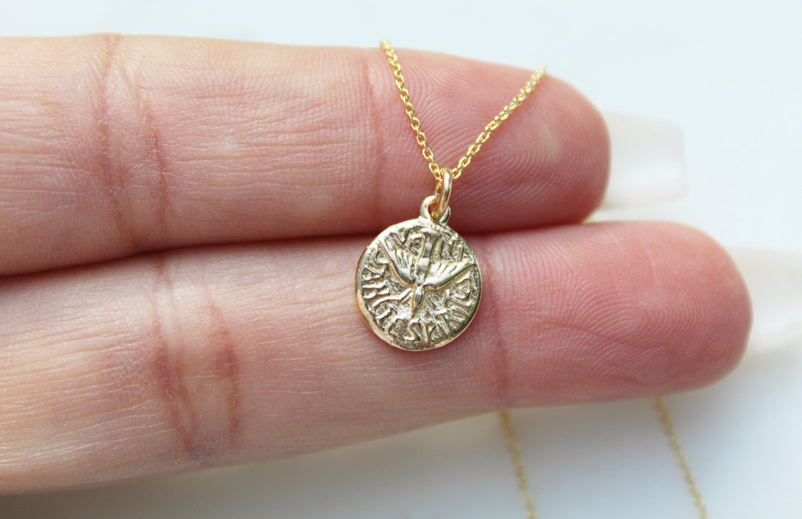 14k gold Holy Spirit necklace with round medallion pendant and thin chain