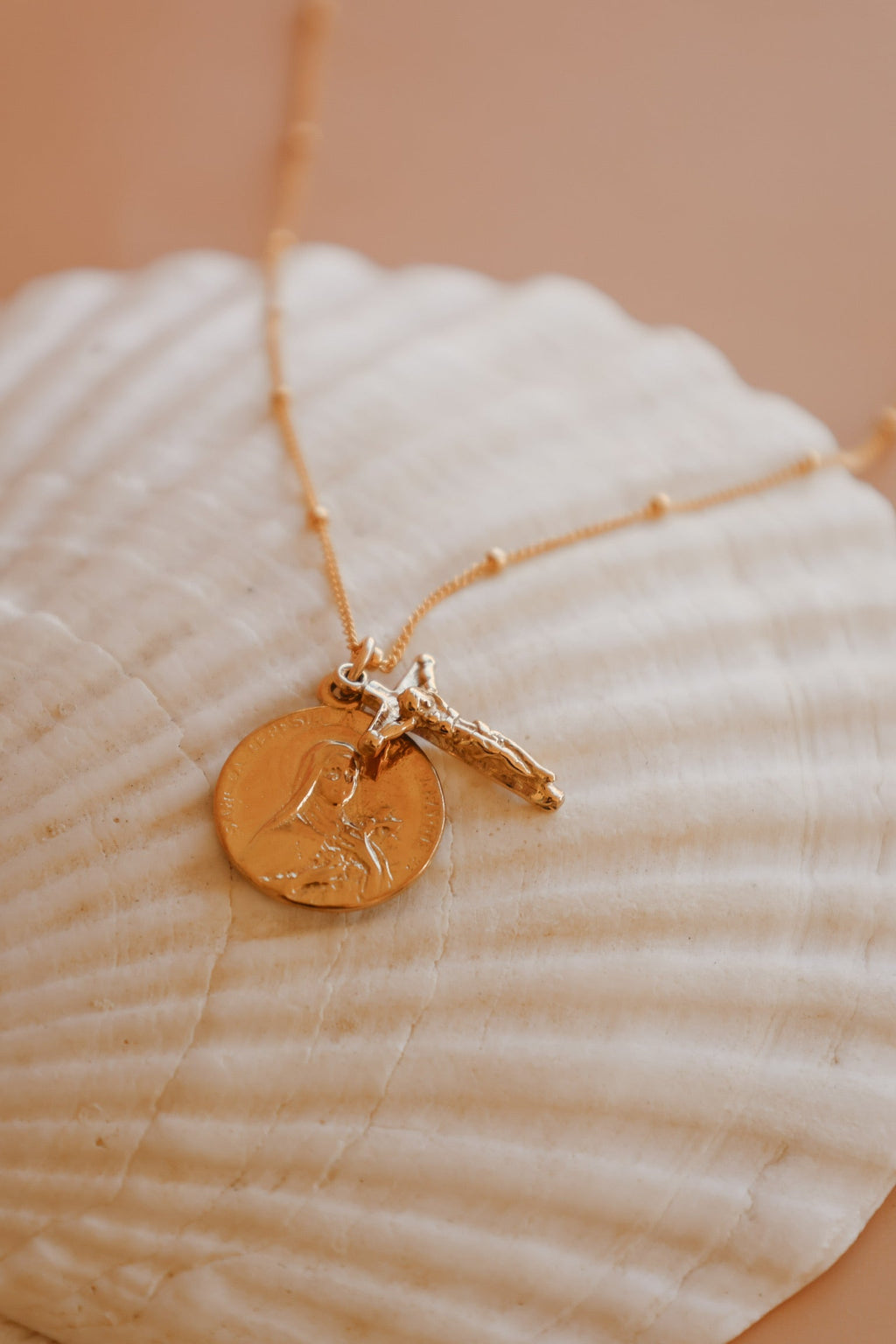 St. Therese of Lisieux crucifix necklace with gold-tone cross and coin charm
