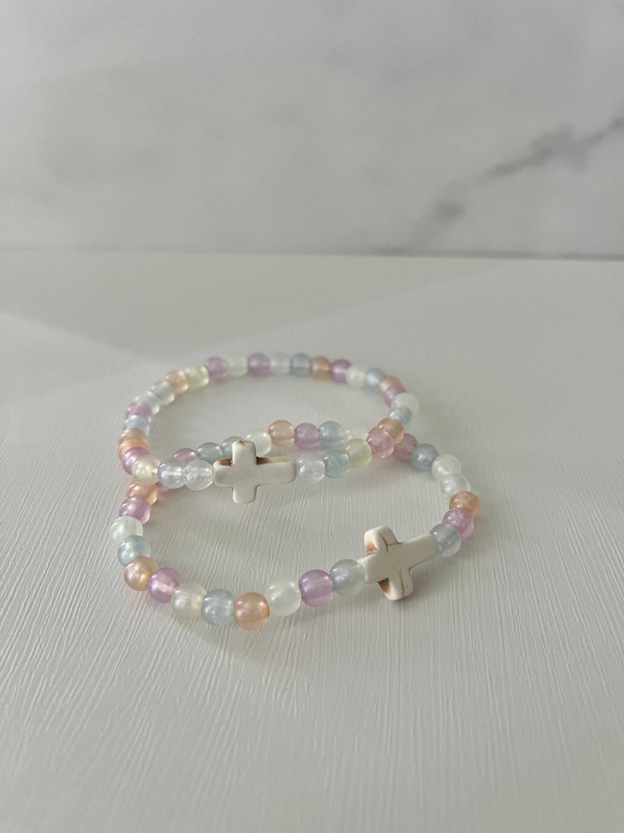 Colorful bead bracelet with pastel beads and small cross charms
