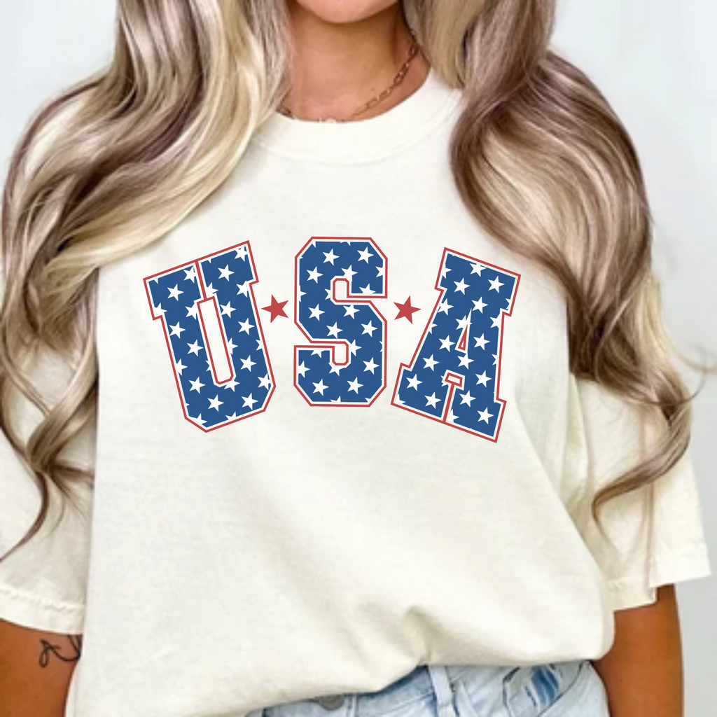 White graphic T-shirt with USA stars-and-stripes lettering