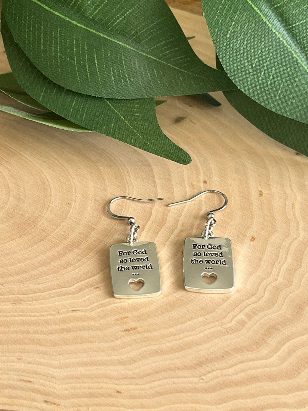 Silver dangle earrings with square tags, heart cutout and 'For God so loved the world' text