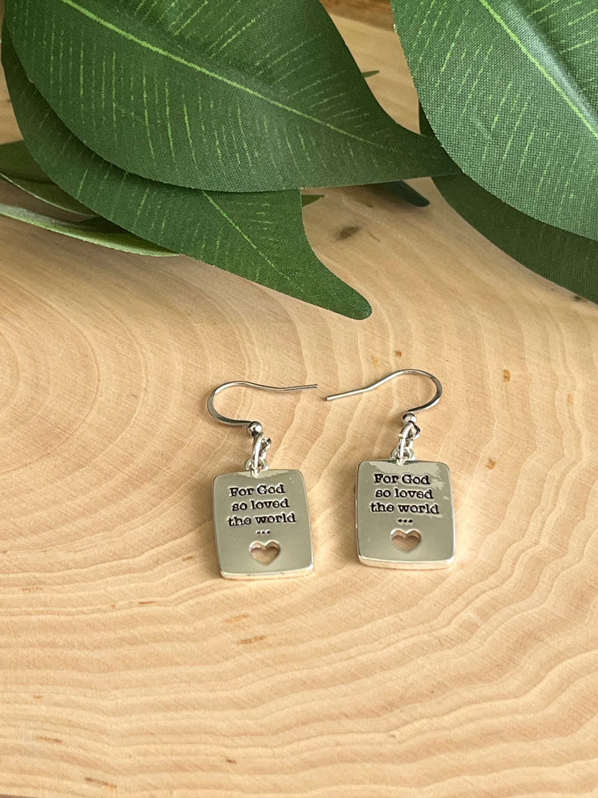Silver dangle earrings with square tags, heart cutout and 'For God so loved the world' text