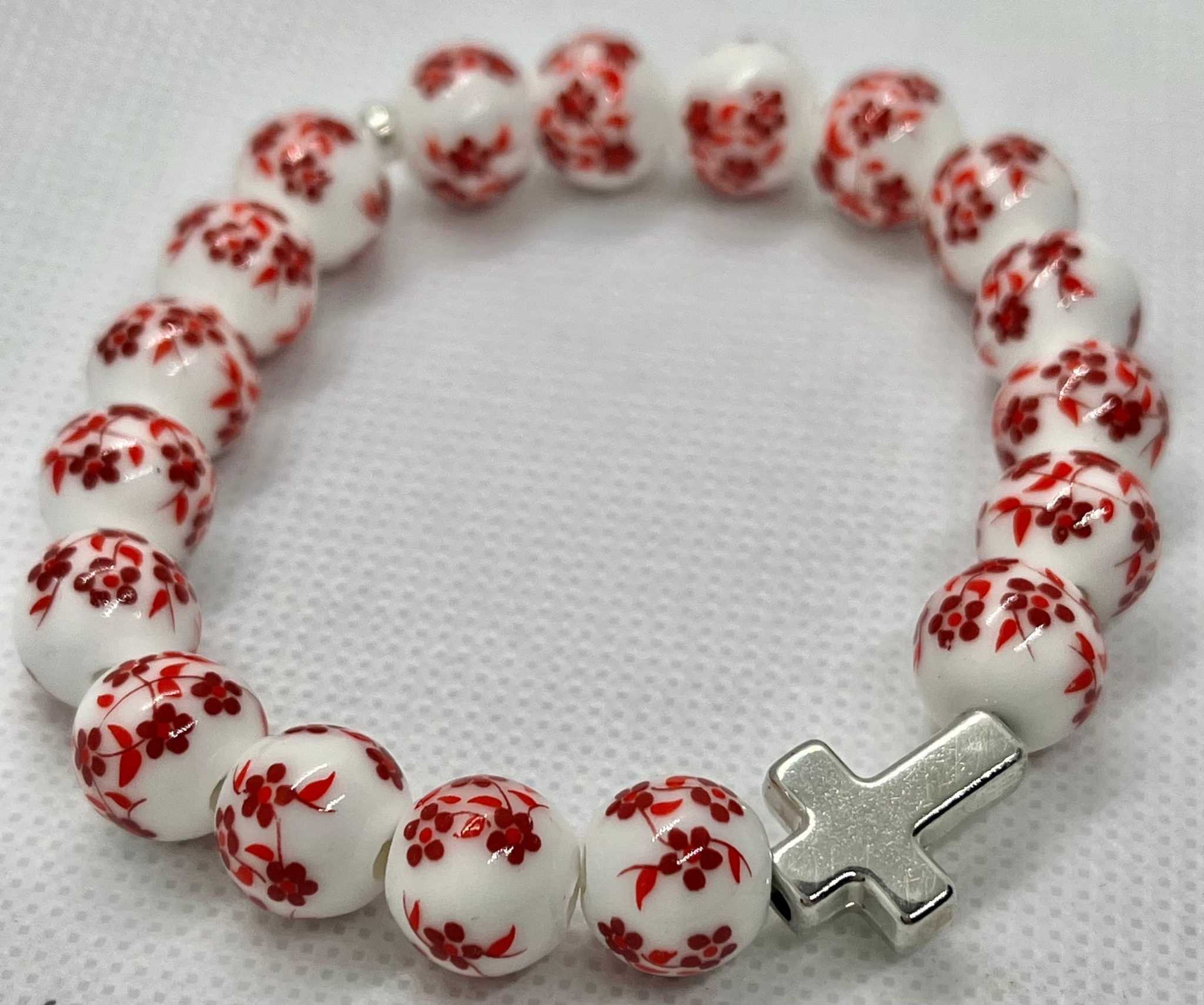 Red and white floral bead cross bracelet with silver cross charm