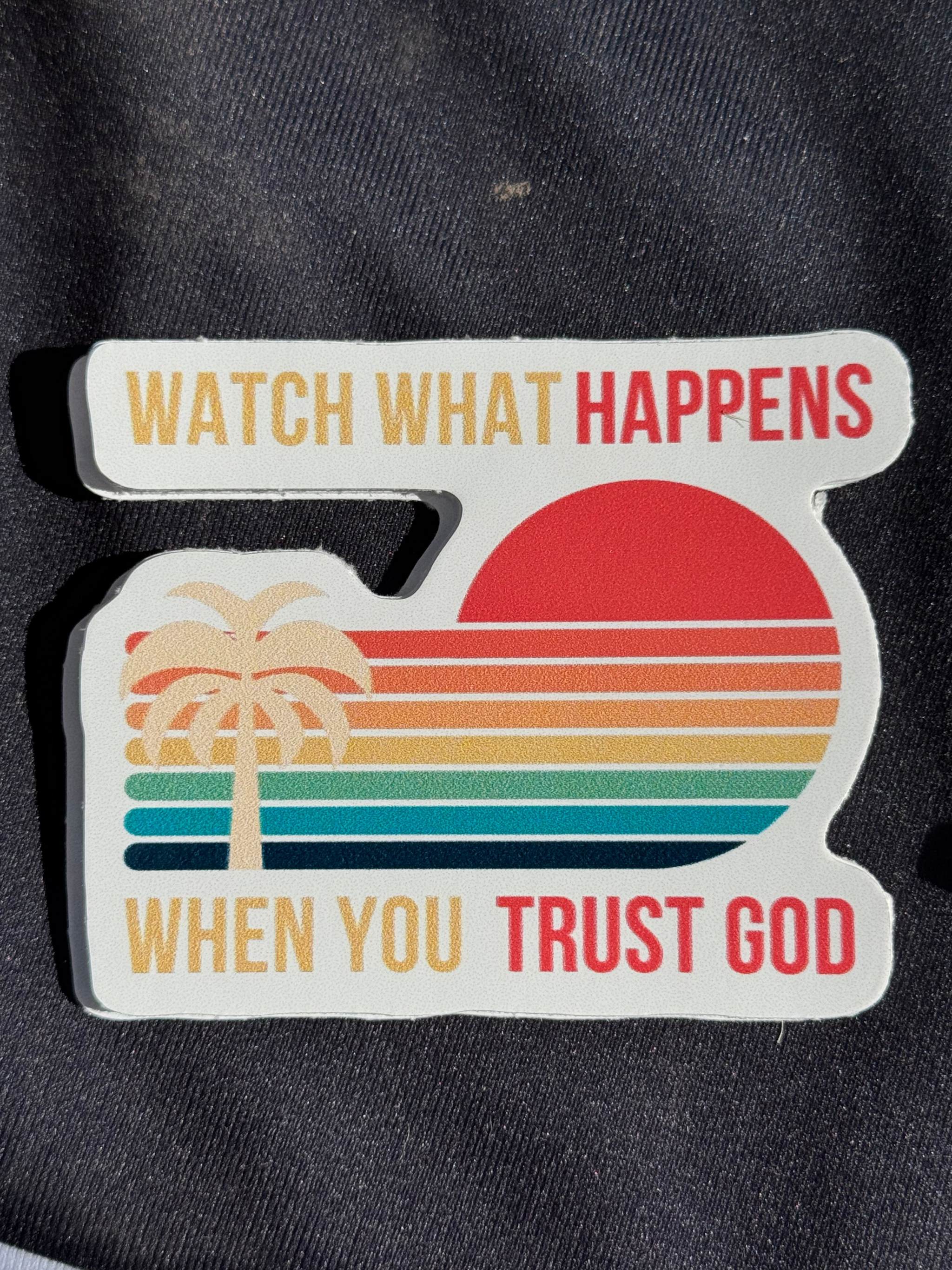 Vinyl sticker with sunset and palm, 'WATCH WHAT HAPPENS' and 'TRUST GOD' text