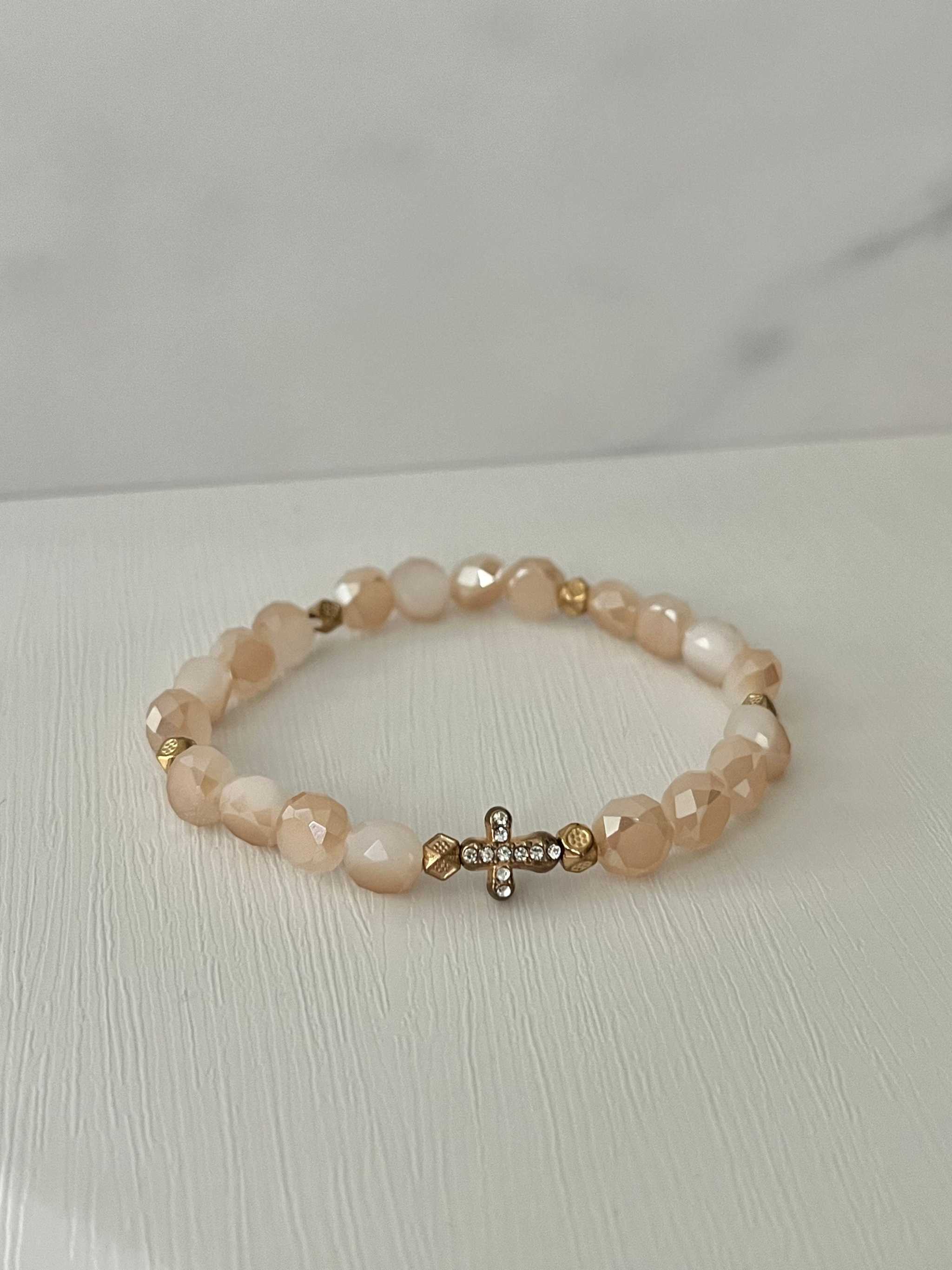 Peach beaded cross bracelet with gold cross charm