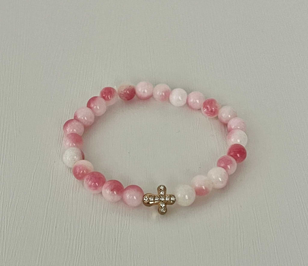 Beaded cross bracelet with pink and translucent beads and rhinestone cross charm