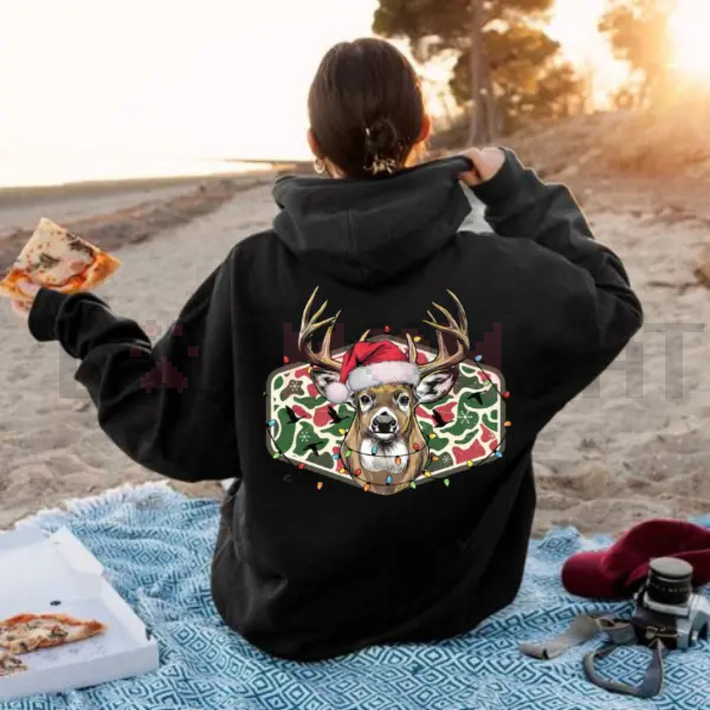 Black hoodie with Christmas deer camo graphic centered on the back.