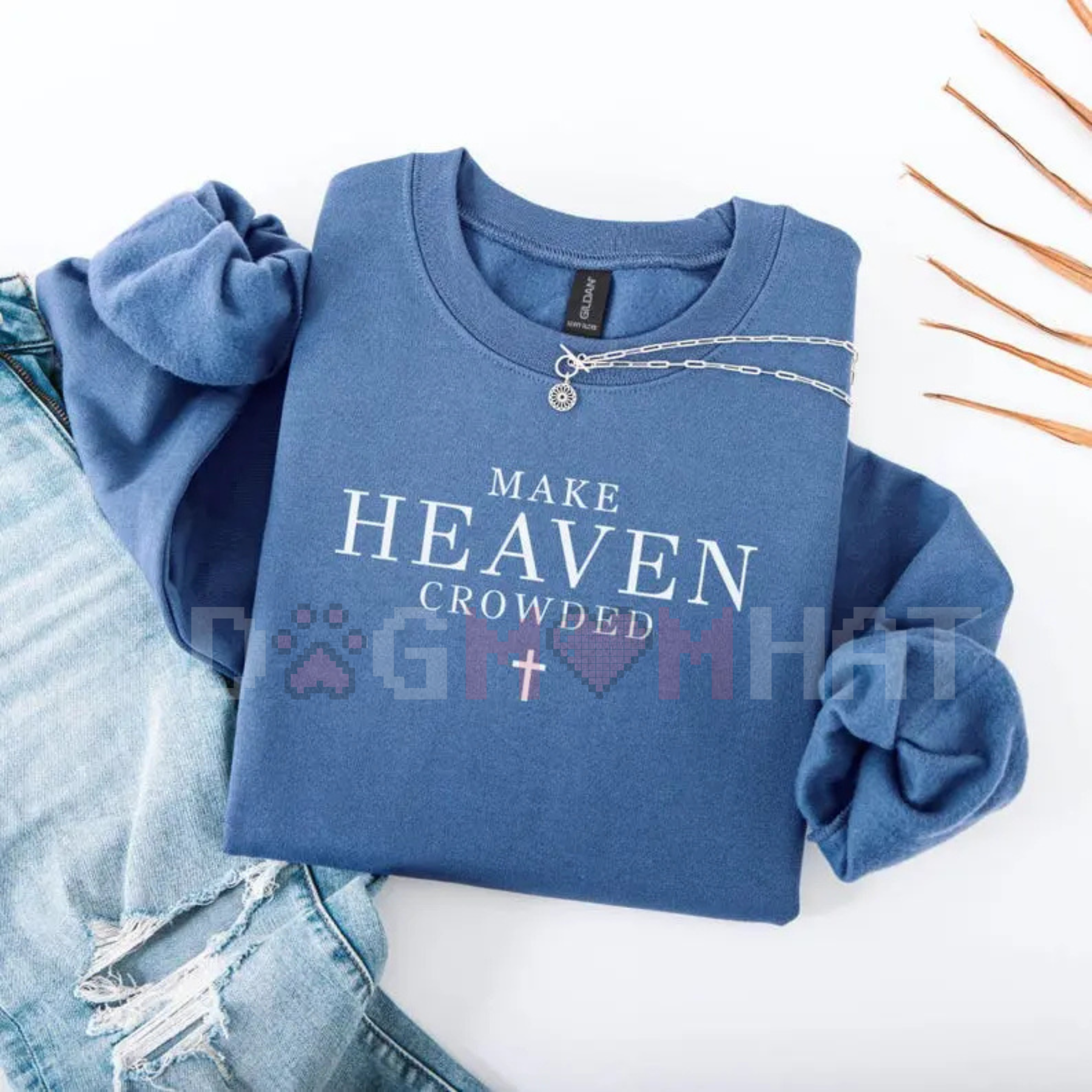 Light blue crewneck sweatshirt with 'MAKE HEAVEN CROWDED' quote and chain graphic
