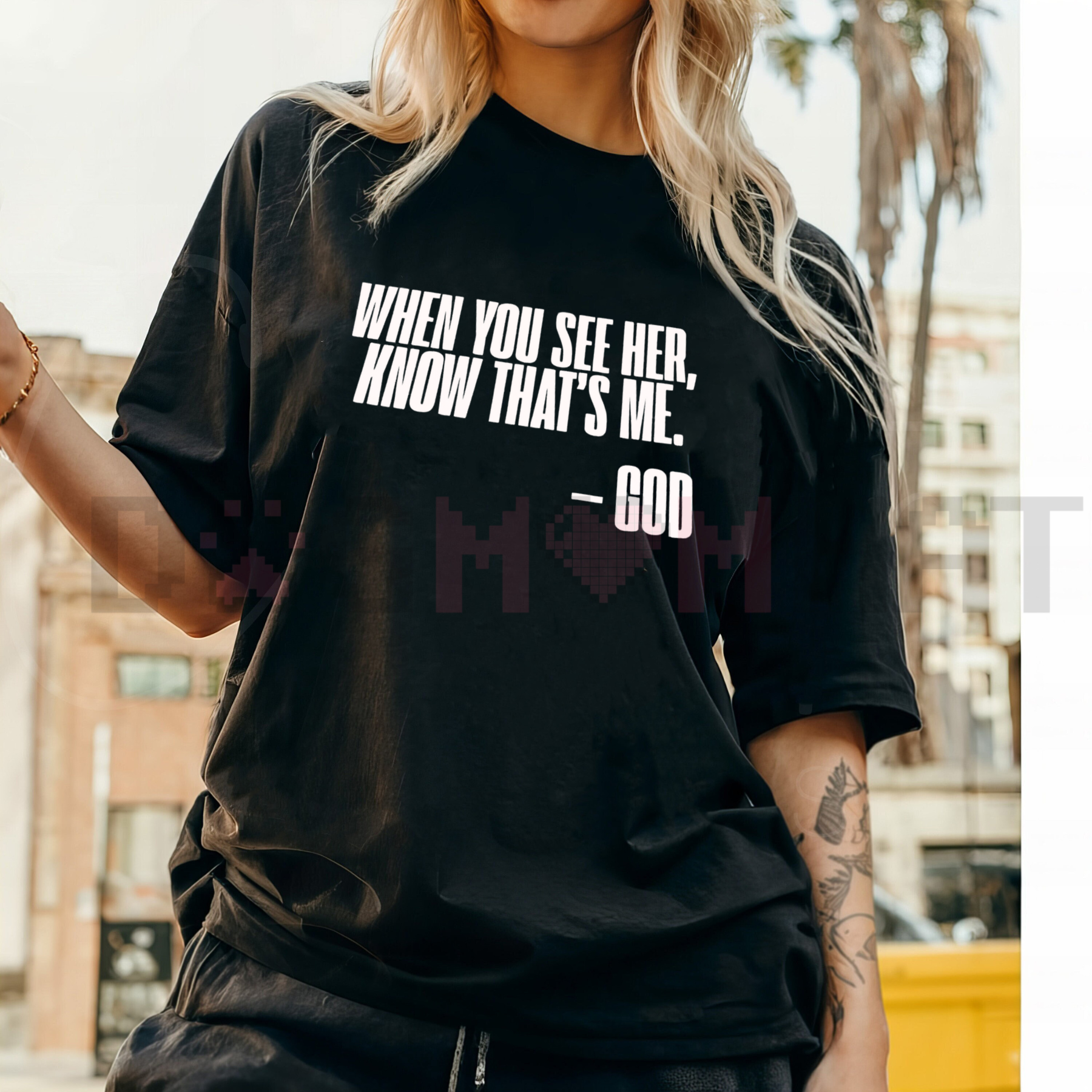 Black God graphic T-shirt with front text and heart design