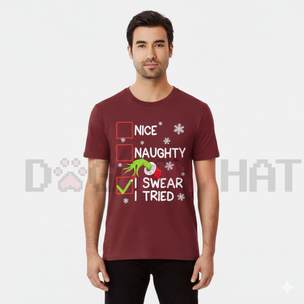 Maroon unisex Christmas graphic tee with 'Nice', 'Naughty', and 'I Swear I Tried' print