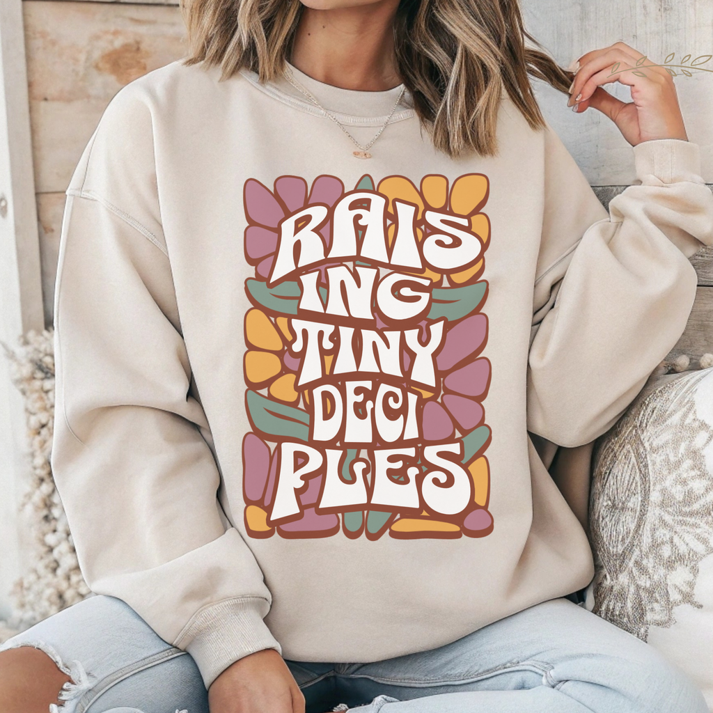 Ivory crewneck sweatshirt with large colorful word graphic on front