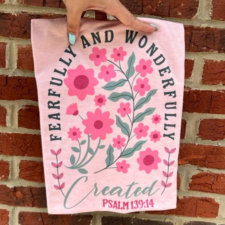 Pink Christian T-shirt with floral print and 'FEARFULLY AND WONDERFULLY CREATED' text