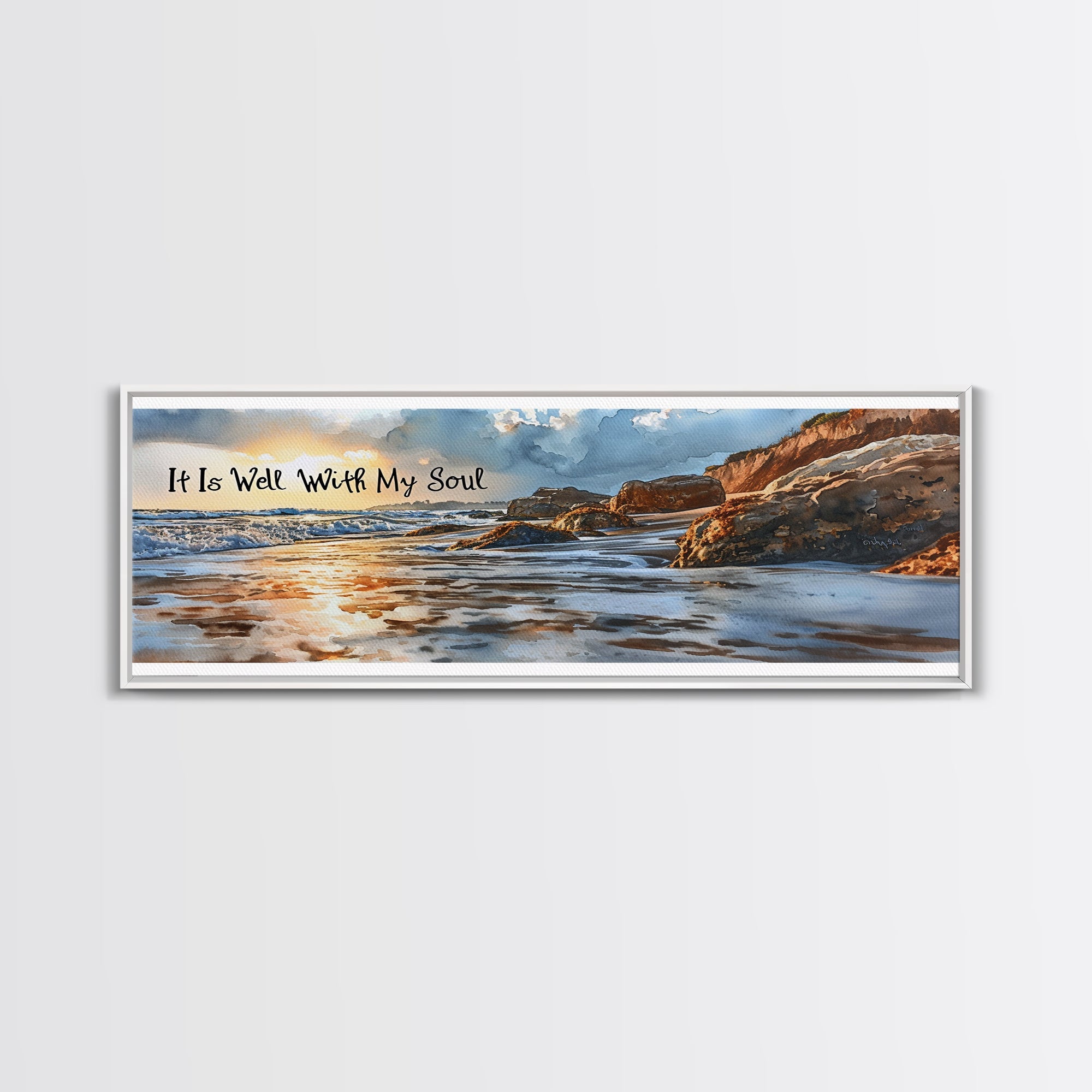 Coastal beach wall art canvas in gold-toned frame with scripture text and rocky shoreline