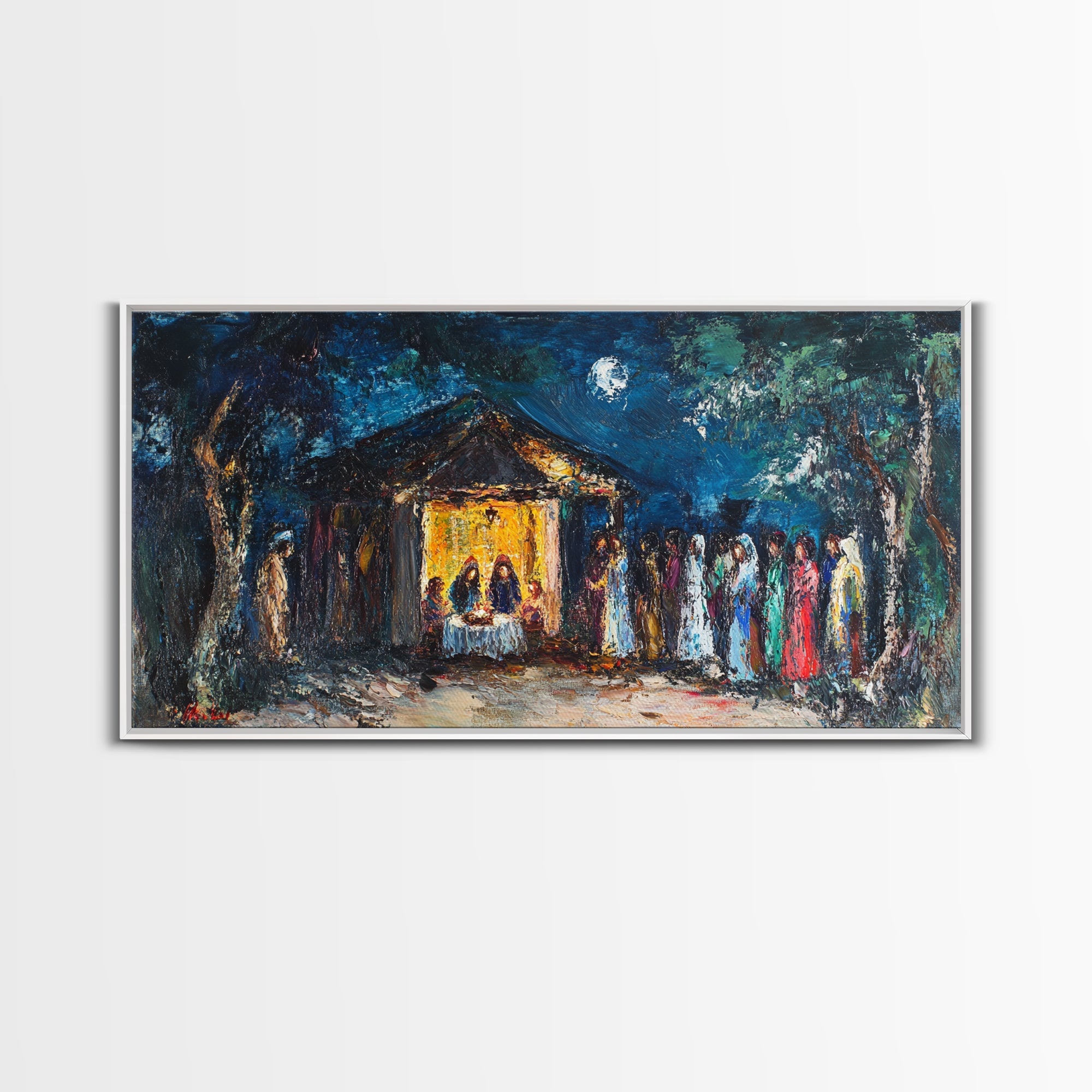 Framed canvas print with blue-toned night scene, yellow chapel, and people in red and green