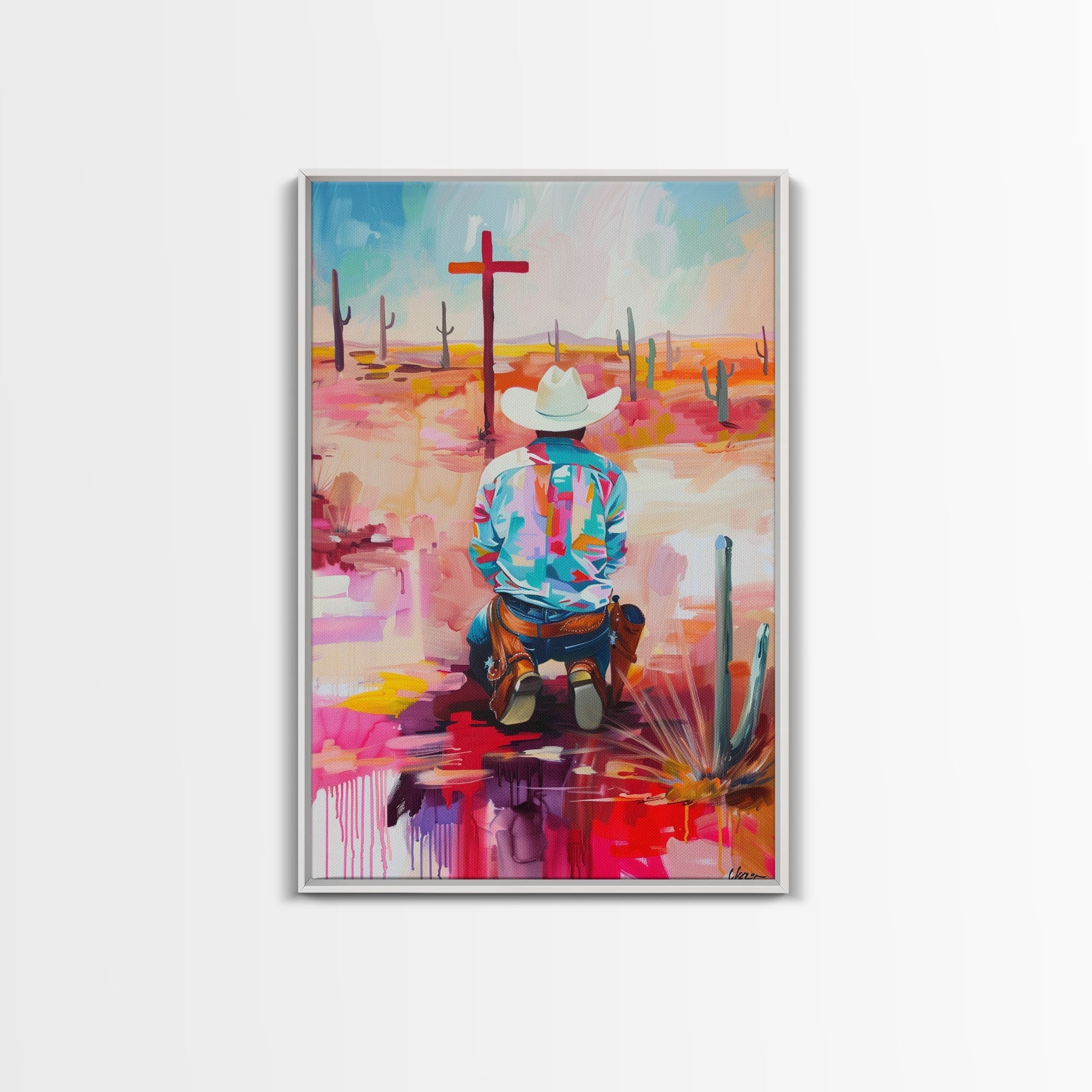 Framed canvas print of an abstract kneeling cowboy in a colorful Southwestern desert scene, light frame