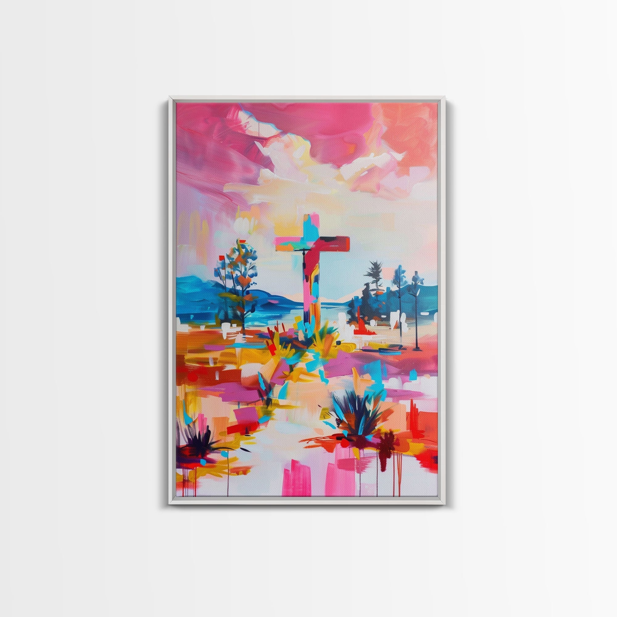 Silver framed canvas wall art with colorful cross in vibrant landscape