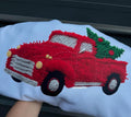 Faux yarn Christmas truck graphic sweatshirt, light blue with red truck and green tree accents