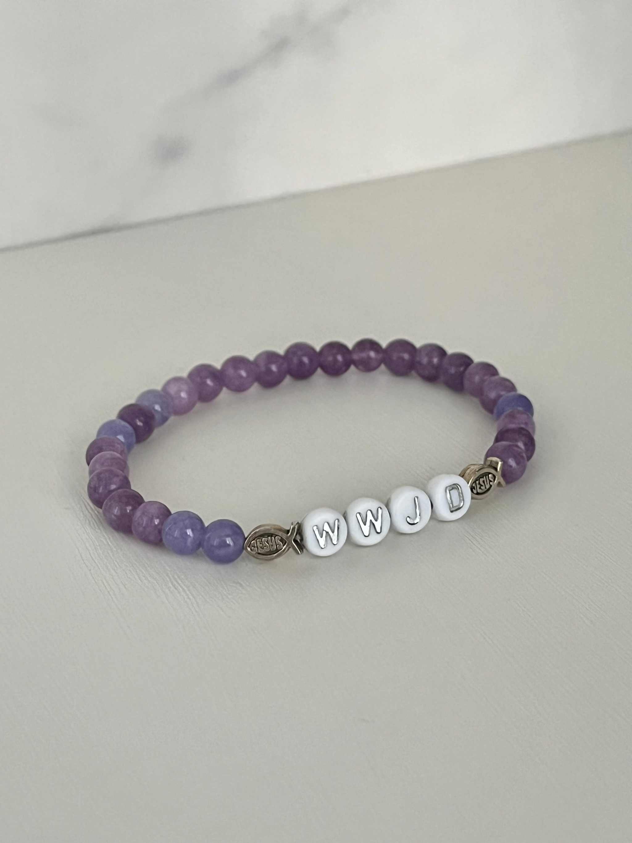 Purple bead bracelet with WWJD letter beads and metal faith charm