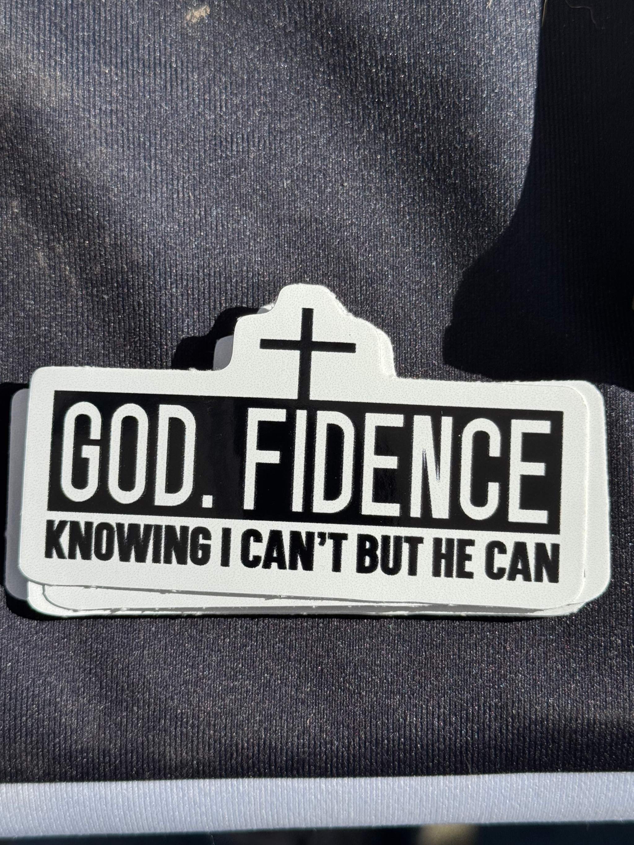 Vinyl sticker reading 'GOD. FIDENCE' with cross and 'KNOWING I CAN’T...' quote