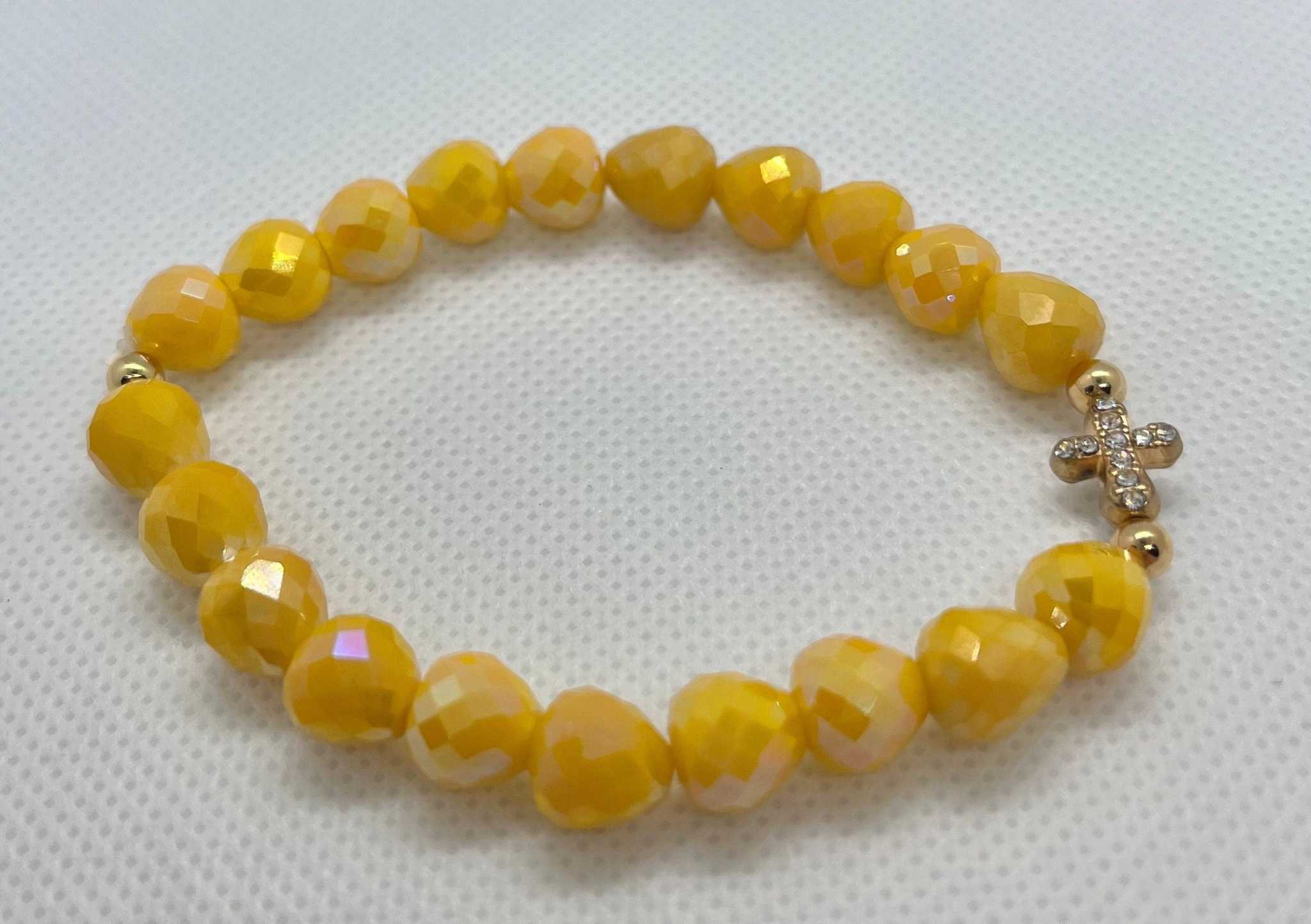Beaded cross bracelet with round yellow glass beads and rhinestone cross clasp