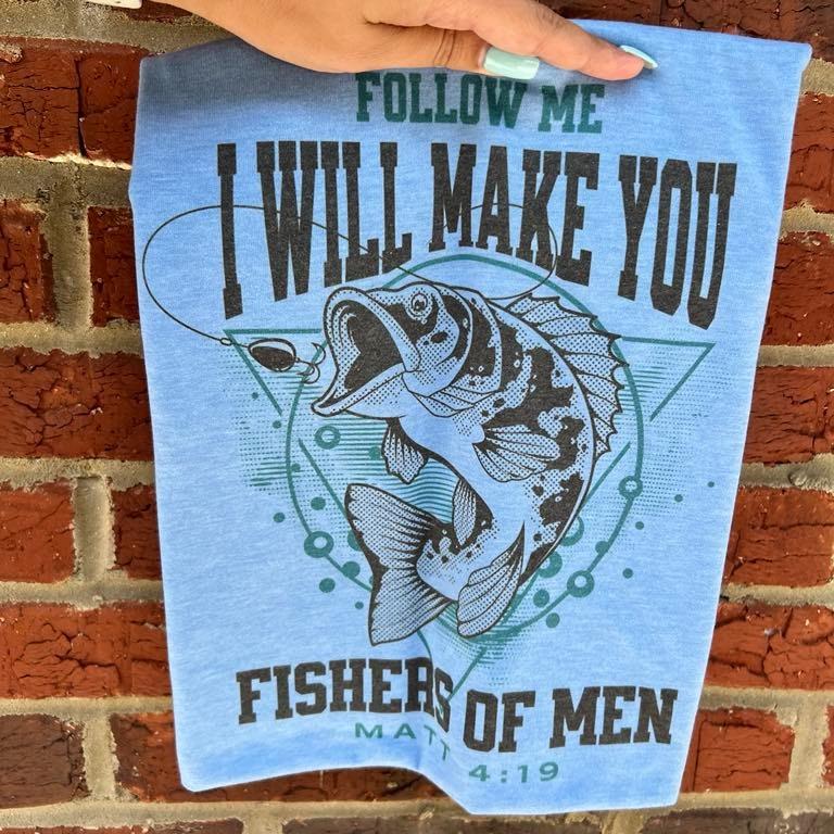 Light blue Christian T-shirt with fish illustration and 'FISHERS OF MEN' text