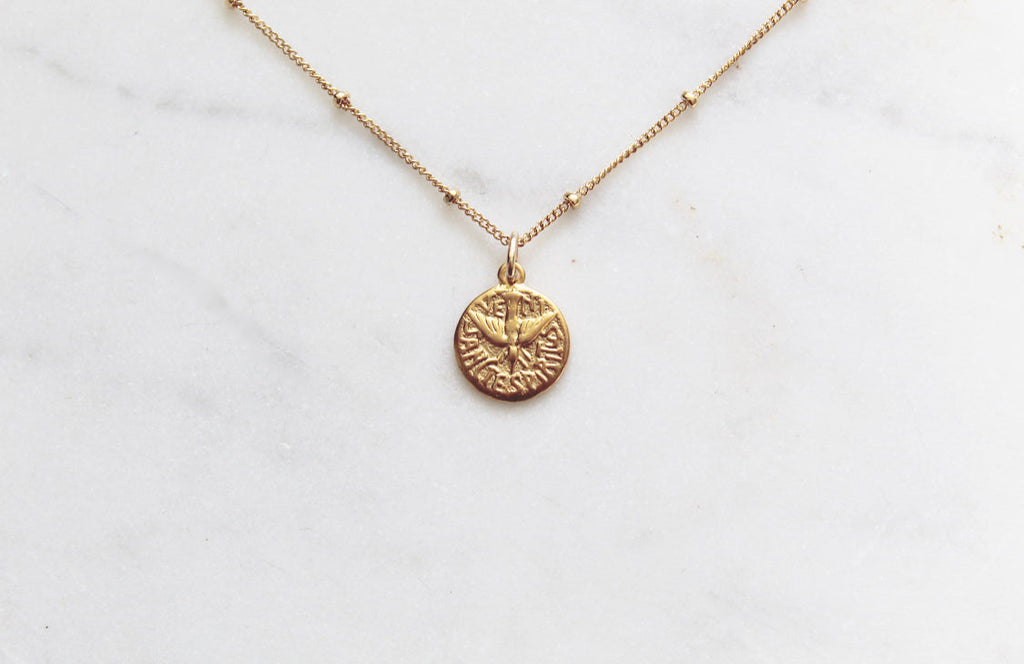 Gold chain necklace with round Holy Spirit coin-style pendant