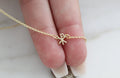 14K gold necklace with Chi Rho pendant charm on a fine chain