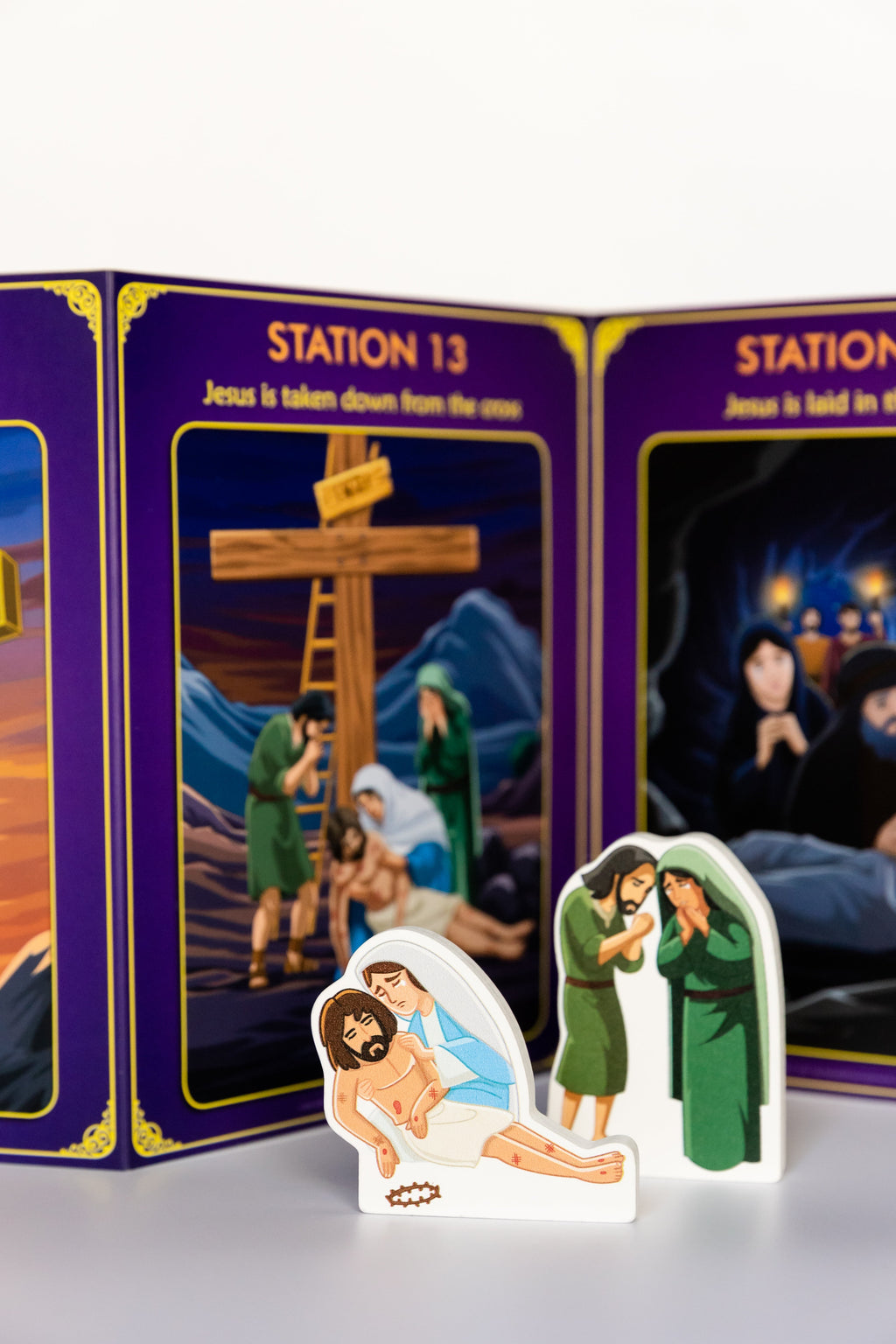 Station cards with character cutouts and a manger scene piece for Stations of the Cross