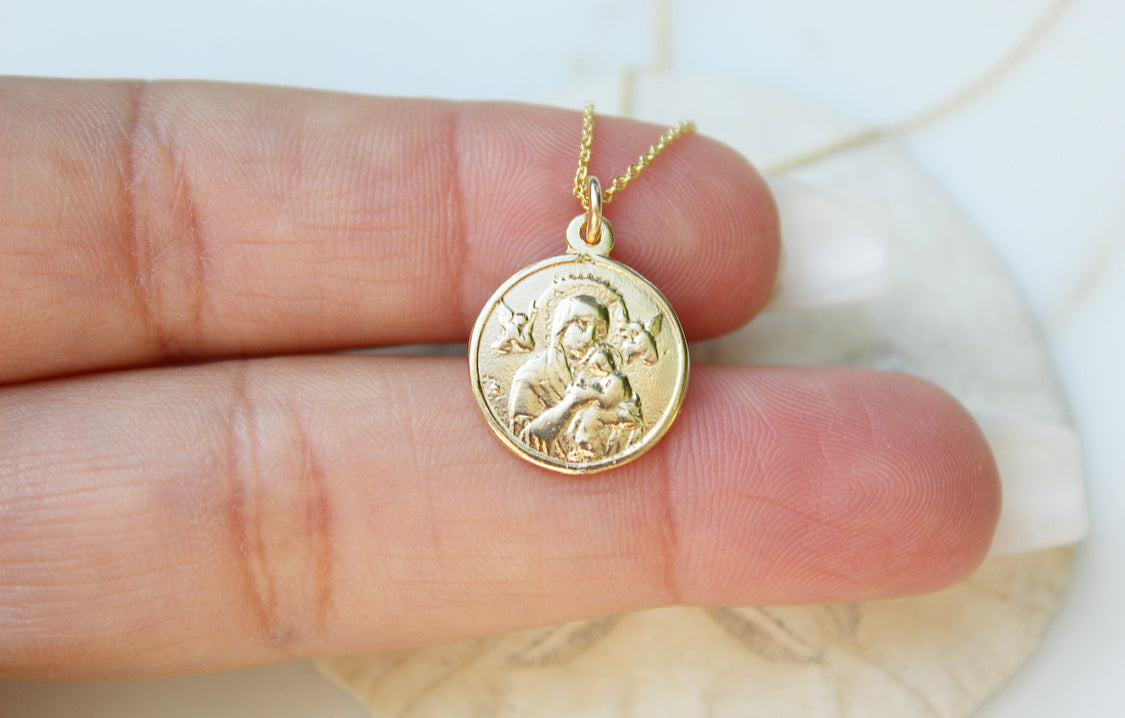 14k gold pendant necklace with round Our Lady medallion featuring raised relief