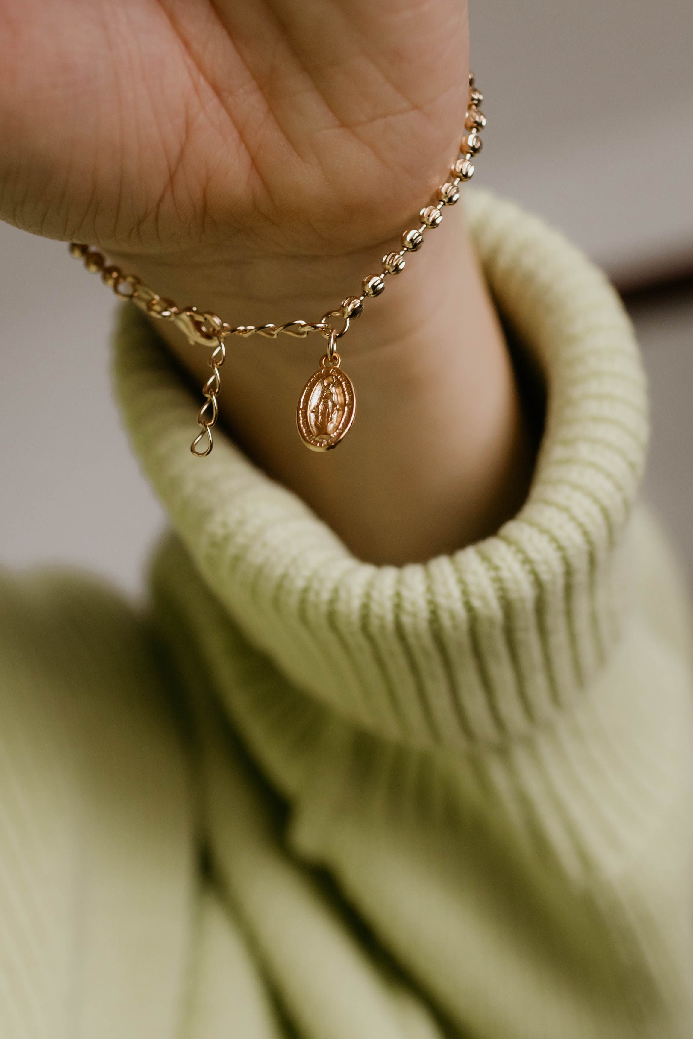 Gold-tone chain bracelet with oval Miraculous medal charm