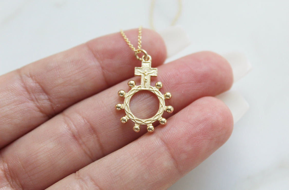 14k gold rosary bead necklace pendant with round ring, bead halo, and cross