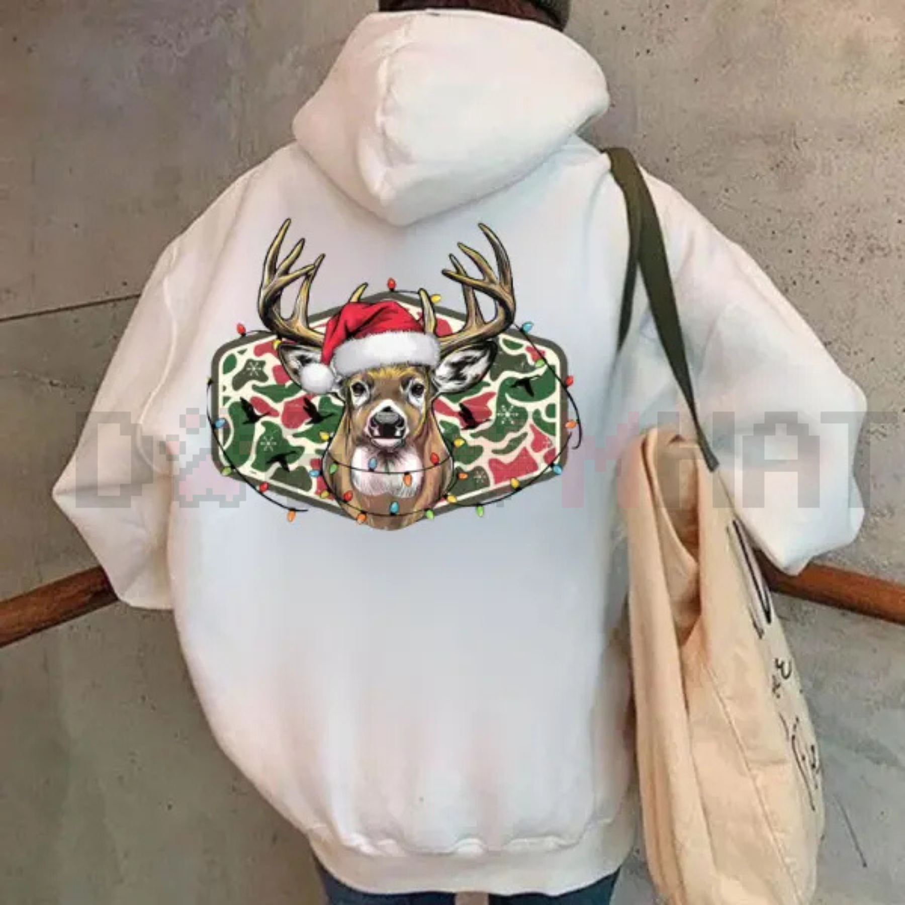 Light-cream hoodie back view with Christmas deer camo graphic under the hood.
