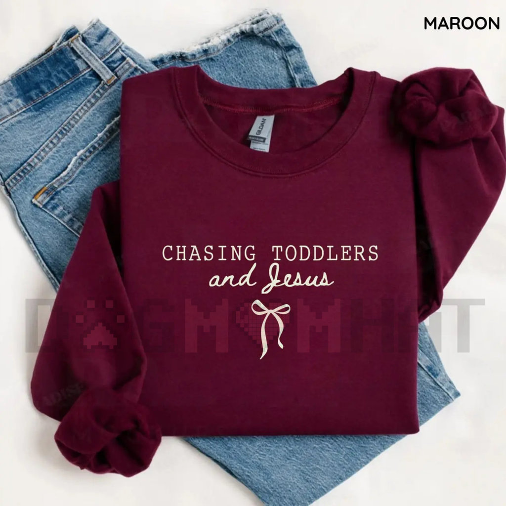 Maroon sweatshirt with puff sleeves and 'Chasing Toddlers and Jesus' graphic