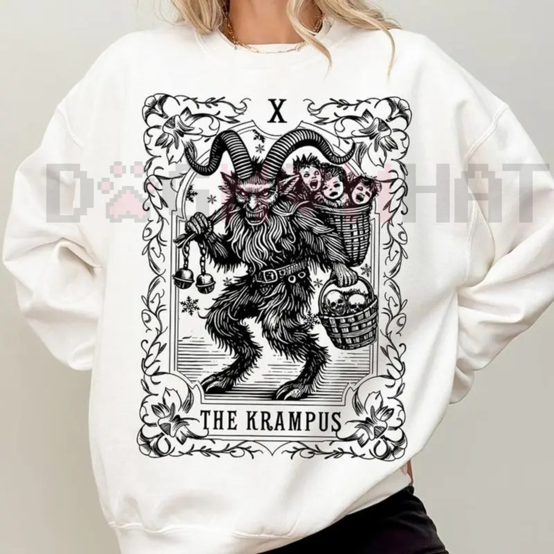 White sweatshirt with large Krampus tarot-style graphic on the front