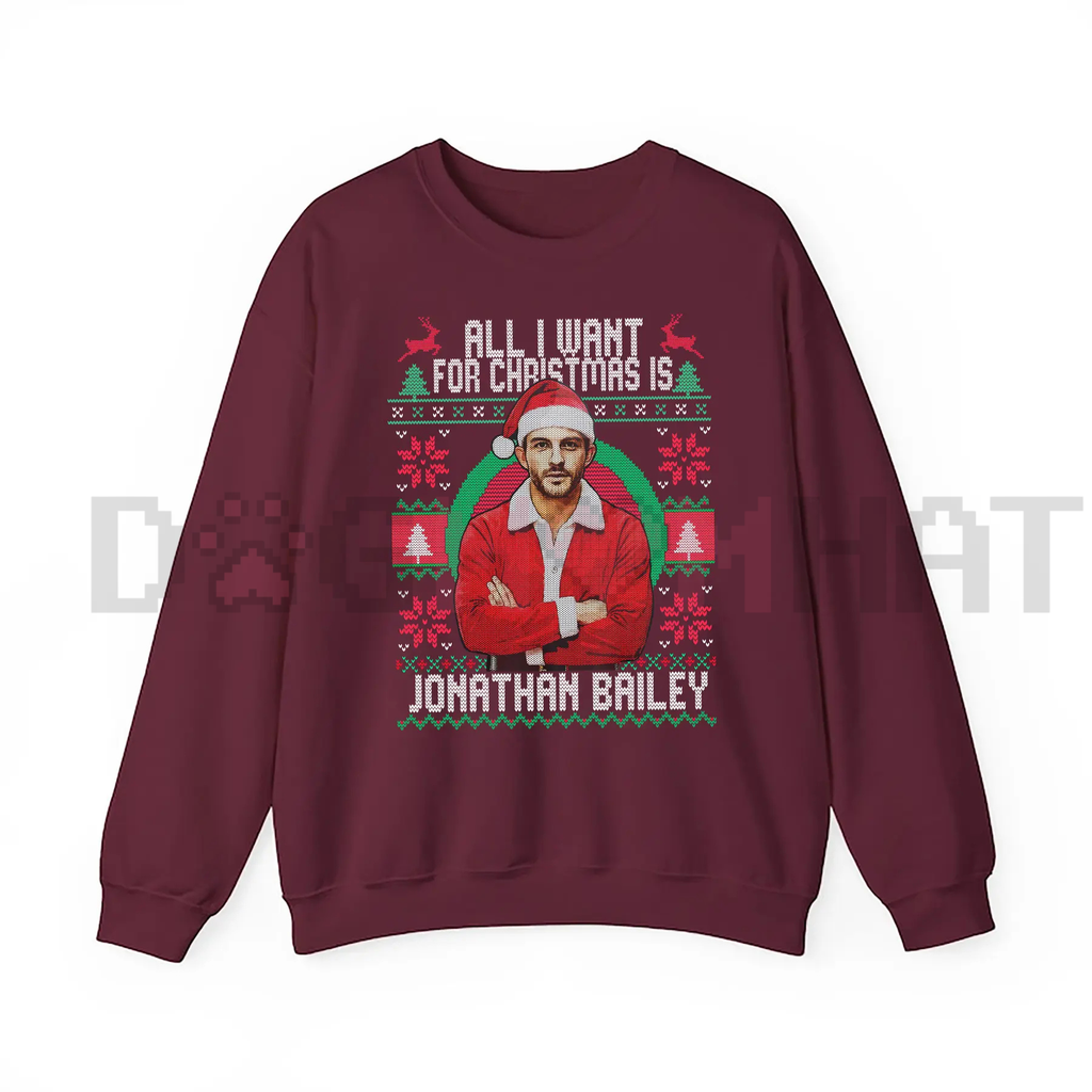 Burgundy crewneck sweatshirt with holiday portrait graphic and text on front.