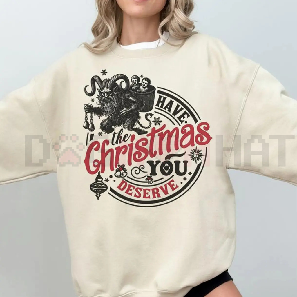 Cream sweatshirt with gothic graphic: “Have the Christmas you deserve”.