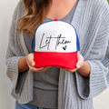Patriotic baseball cap with white front panel, blue sides, red brim, 'Let them' text.