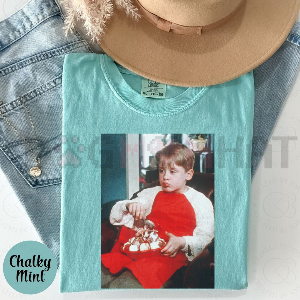 Light teal Christmas t-shirt with front photo graphic of a boy holding toys