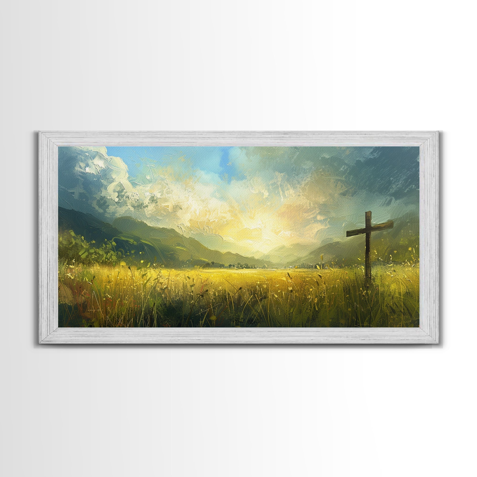 White framed canvas print with a cross in yellow-green grass and glowing sky