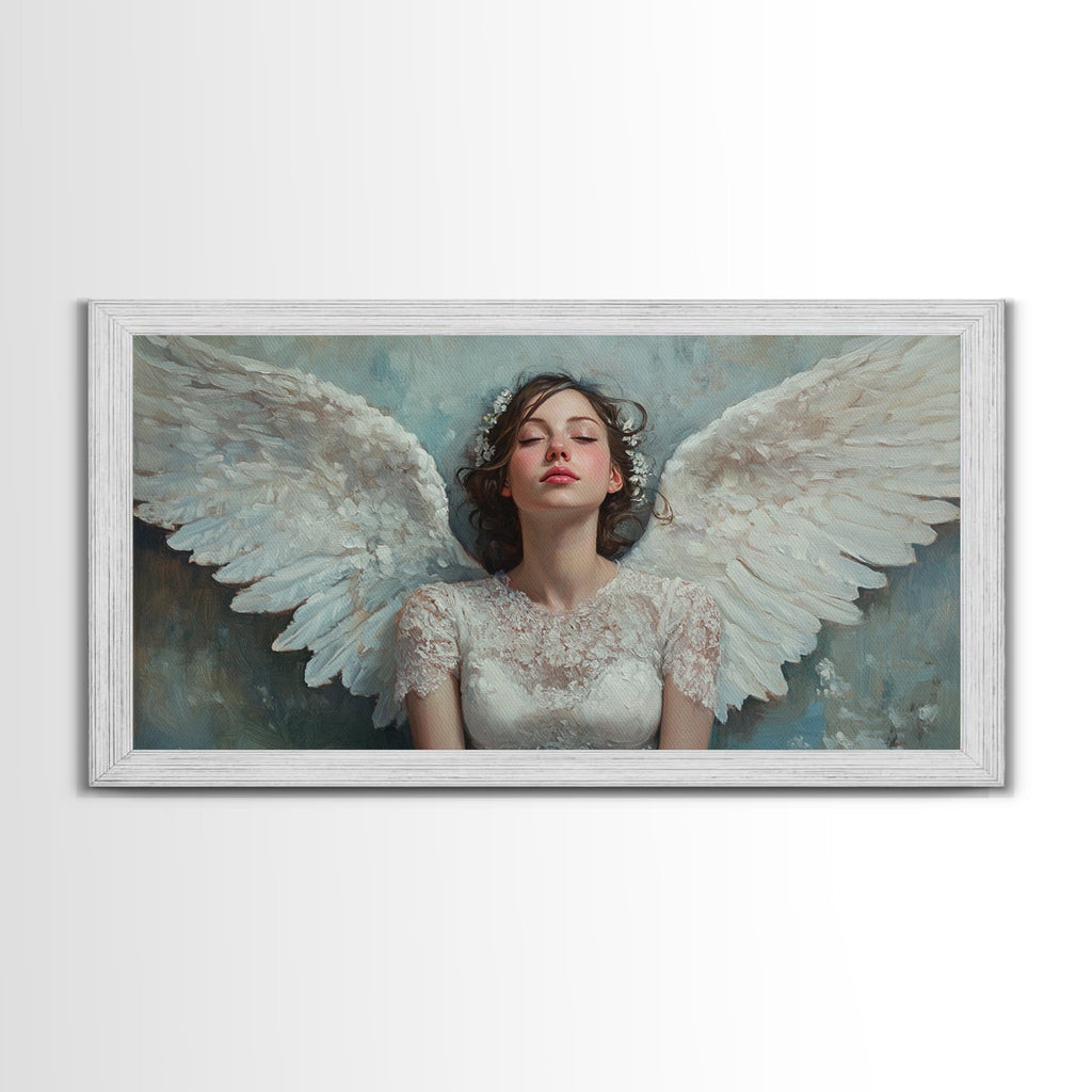 Framed angel canvas print with white wings and pale blue tones, white ornate frame