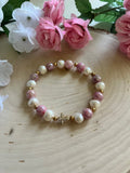 Pink and white pearl bead bracelet with small gold cross charm