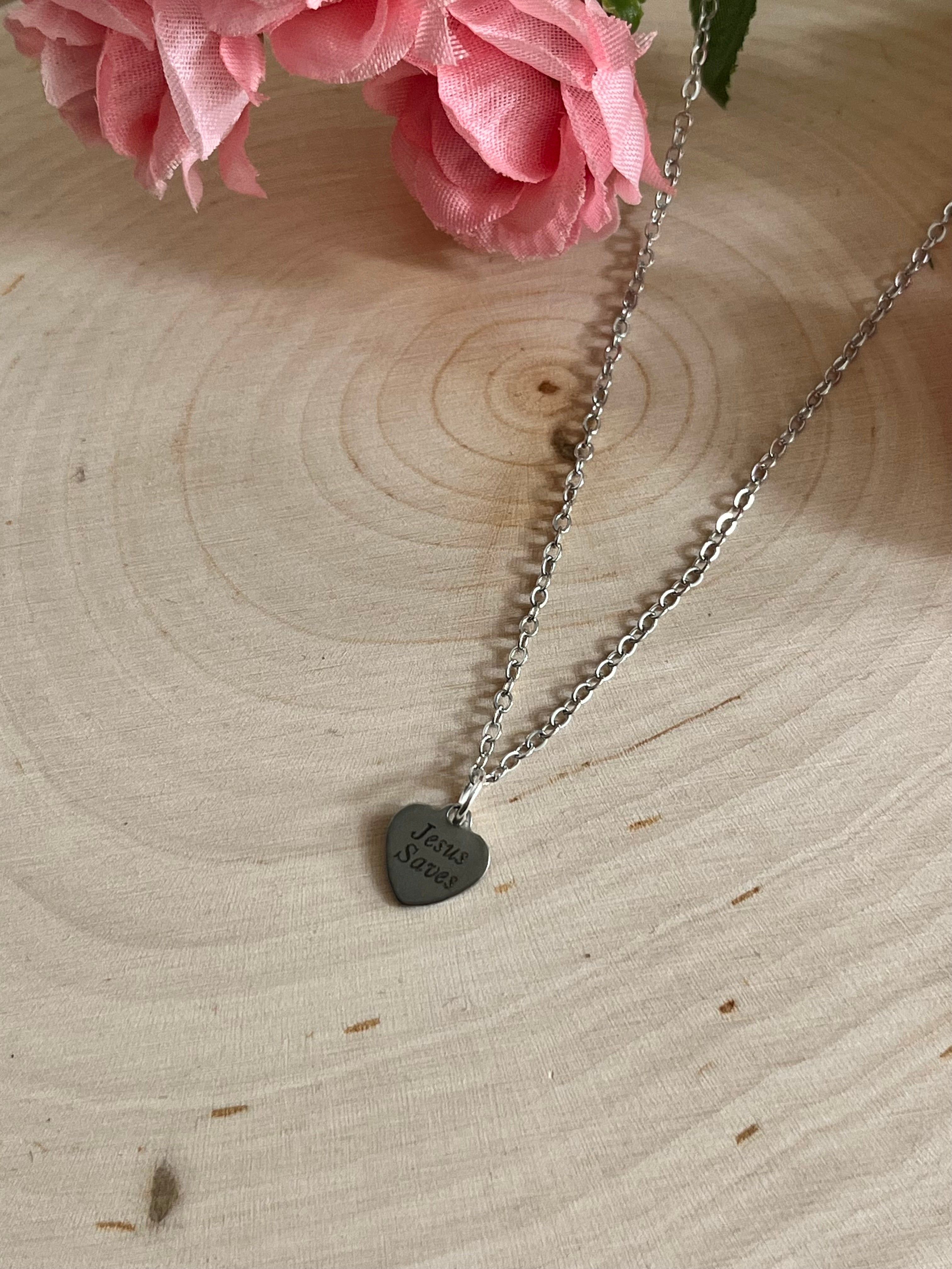 Silver chain necklace with round Jesus Saves pendant on front