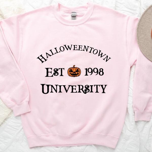 Light pink crewneck sweatshirt with 'Halloweentown EST 1998 UNIVERSITY' graphic