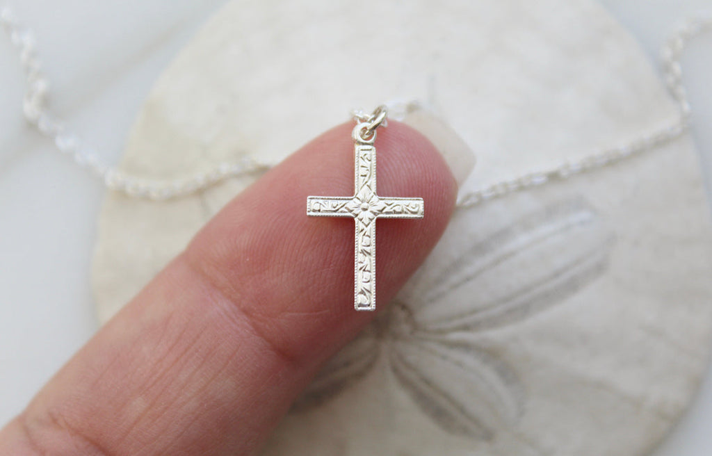 Sterling silver cross pendant necklace with detailed textured cross