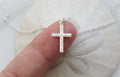 Sterling silver cross pendant necklace with detailed textured cross